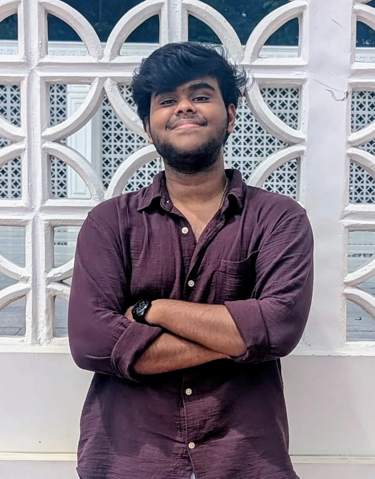 Portrait of Abilaash in a maroon shirt